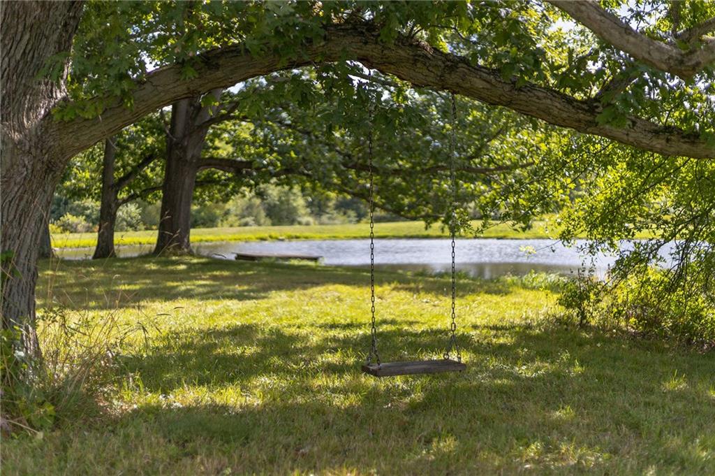 206 Lee Road Grove City, PA 16127 - Photo 24 of 45 a view of a swimming pool with an outdoor seating and yard