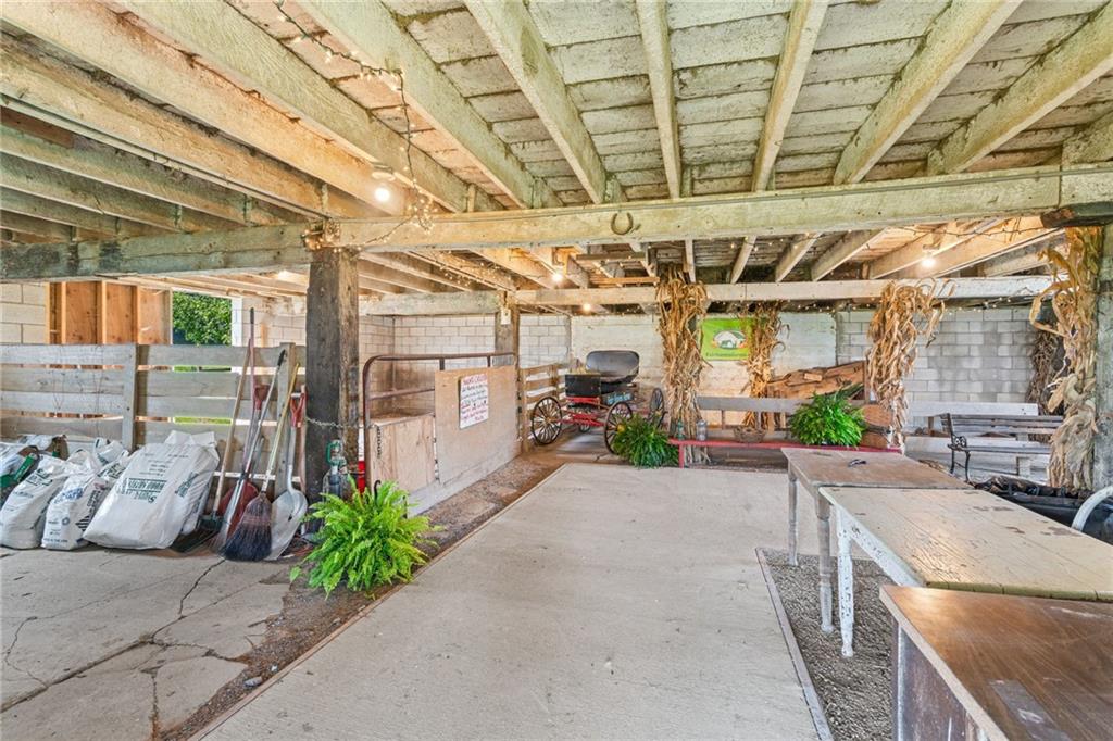 206 Lee Road Grove City, PA 16127 - Photo 27 of 45 a view of a patio with table and chairs potted plants
