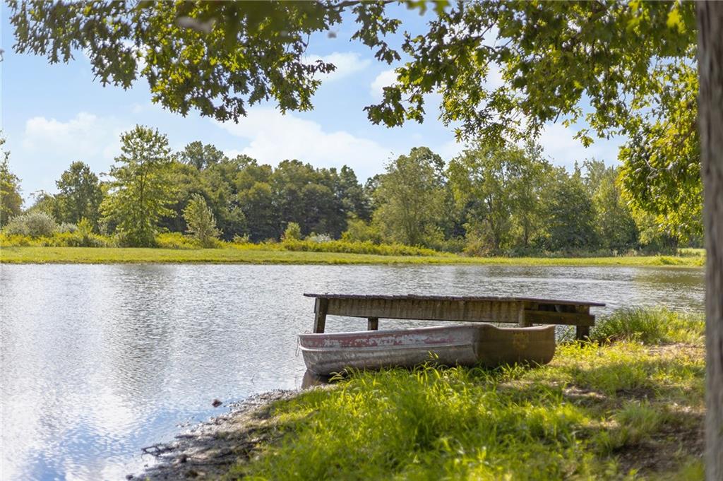 206 Lee Road Grove City, PA 16127 - Photo 30 of 45 a view of a lake with a big yard
