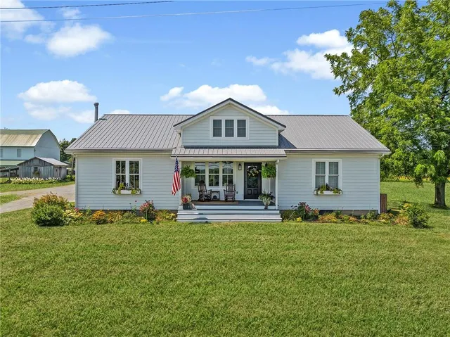 a living room with furniture rug and window