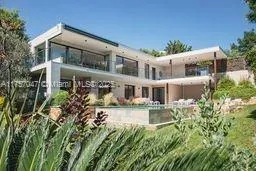 a view of a building with a yard