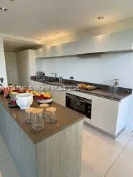 a kitchen with a stove and a cabinets
