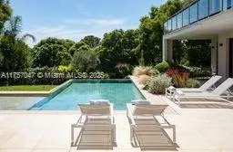 a view of a swimming pool with lounge chair