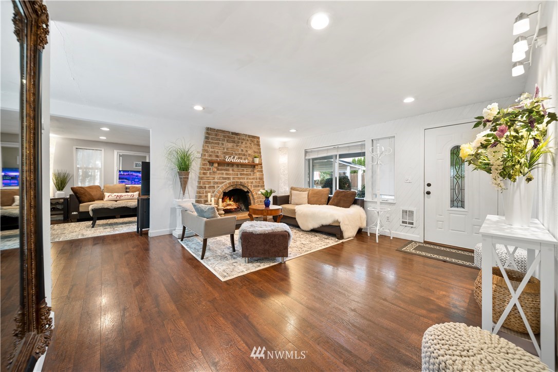 2915 193rd Place Southeast Bothell, WA 98012 - Photo 2 of 17 a living room with furniture or wooden floor and a chandelier