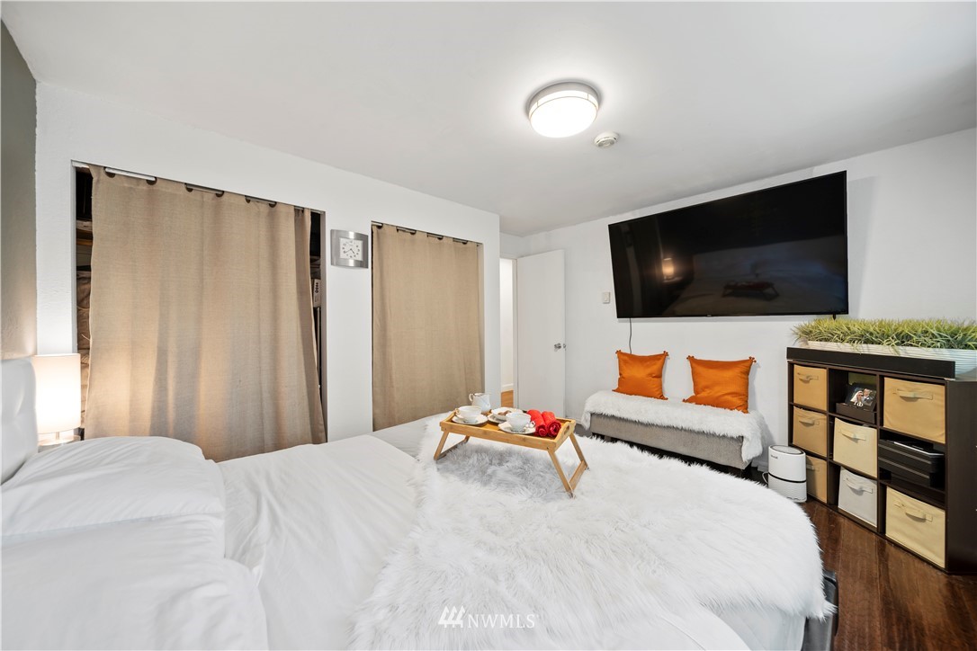 2915 193rd Place Southeast Bothell, WA 98012 - Photo 11 of 17 a bedroom with a bed and a flat screen tv