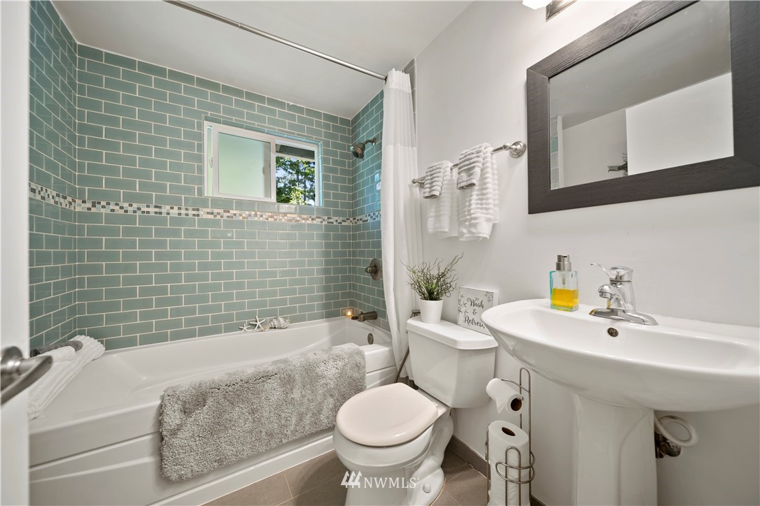 2915 193rd Place Southeast Bothell, WA 98012 - Photo 12 of 17 a bathroom with a sink toilet and shower