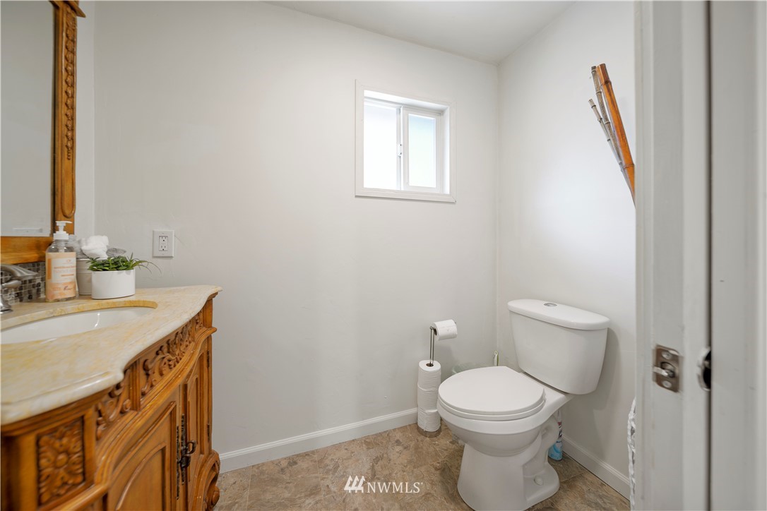 2915 193rd Place Southeast Bothell, WA 98012 - Photo 15 of 17 a bathroom with a sink a toilet and a mirror