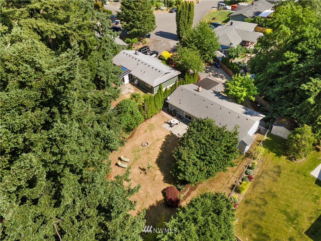 2915 193rd Place Southeast Bothell, WA 98012 - Photo 17 of 17 an aerial view of a house with a yard and trees all around