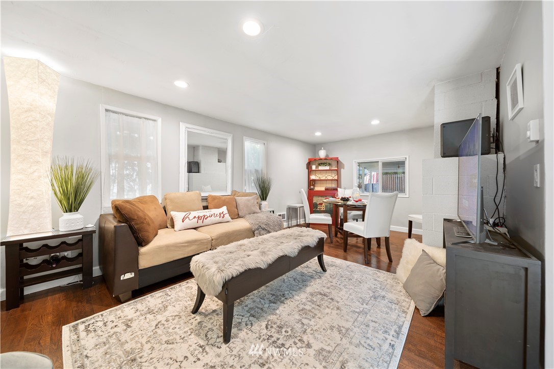 2915 193rd Place Southeast Bothell, WA 98012 - Photo 6 of 17 a living room with furniture a window and a flat screen tv