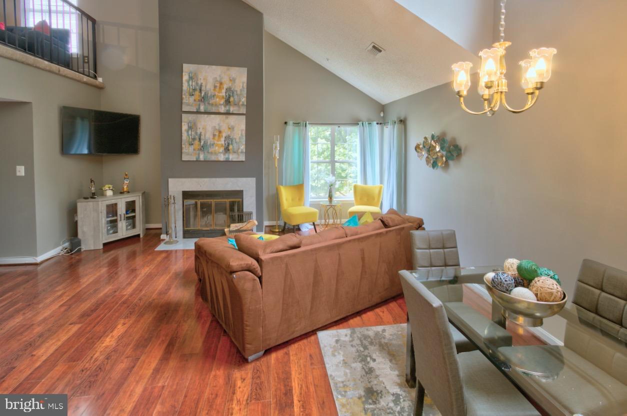1019 Fallcrest Court, Unit 302 Bowie, MD 20721 - Photo 7 of 34 Dining and living areas; with wood burning FP
