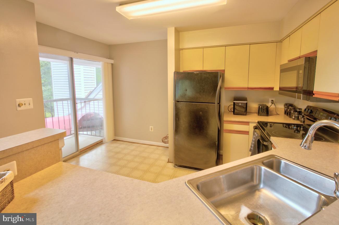 1019 Fallcrest Court, Unit 302 Bowie, MD 20721 - Photo 10 of 34 balcony off eat-in kitchen