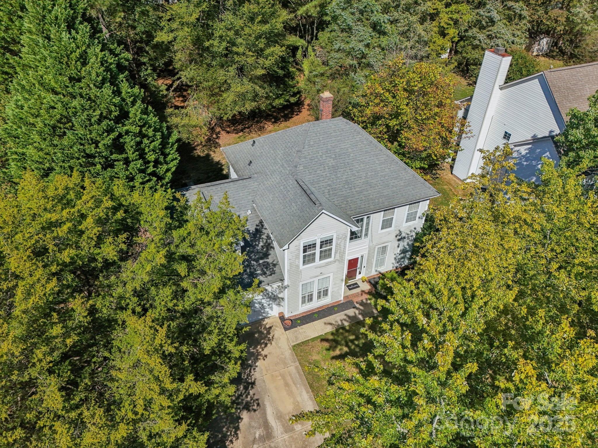 8700 Barrister Way Charlotte, NC 28216 - Photo 1 of 25 an aerial view of a house with a yard and garden