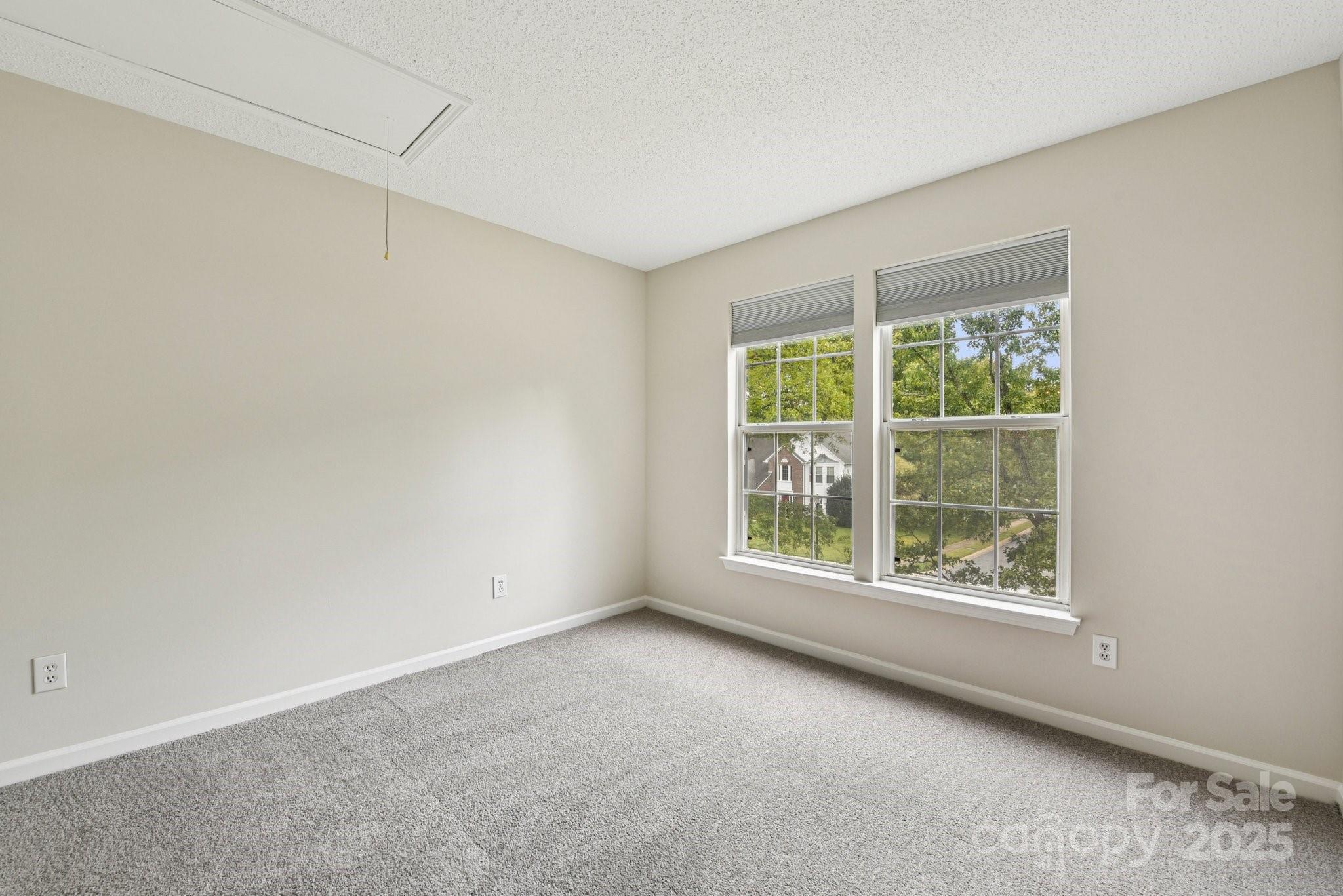 8700 Barrister Way Charlotte, NC 28216 - Photo 13 of 25 an empty room with windows