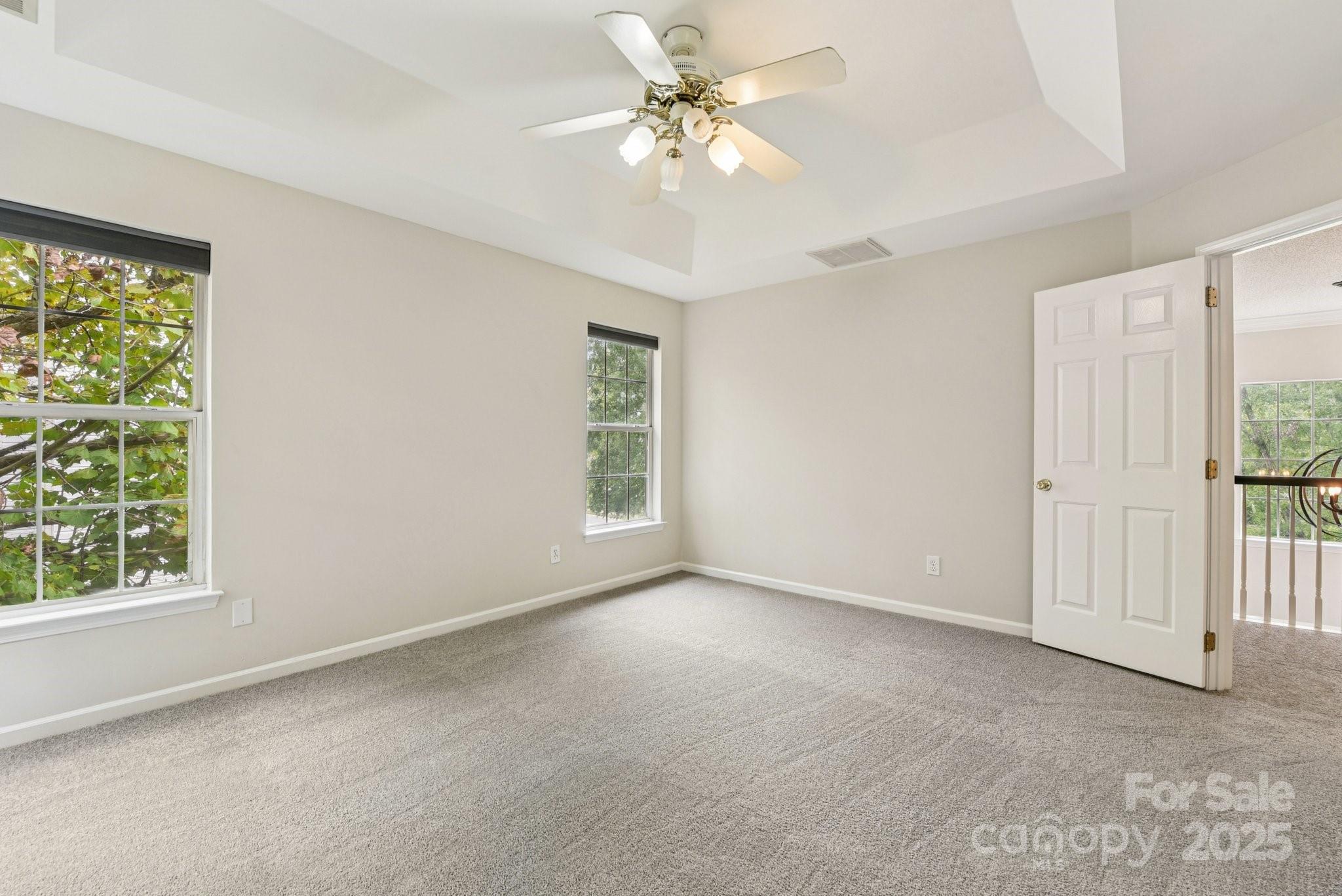 8700 Barrister Way Charlotte, NC 28216 - Photo 19 of 25 an empty room with windows and fan