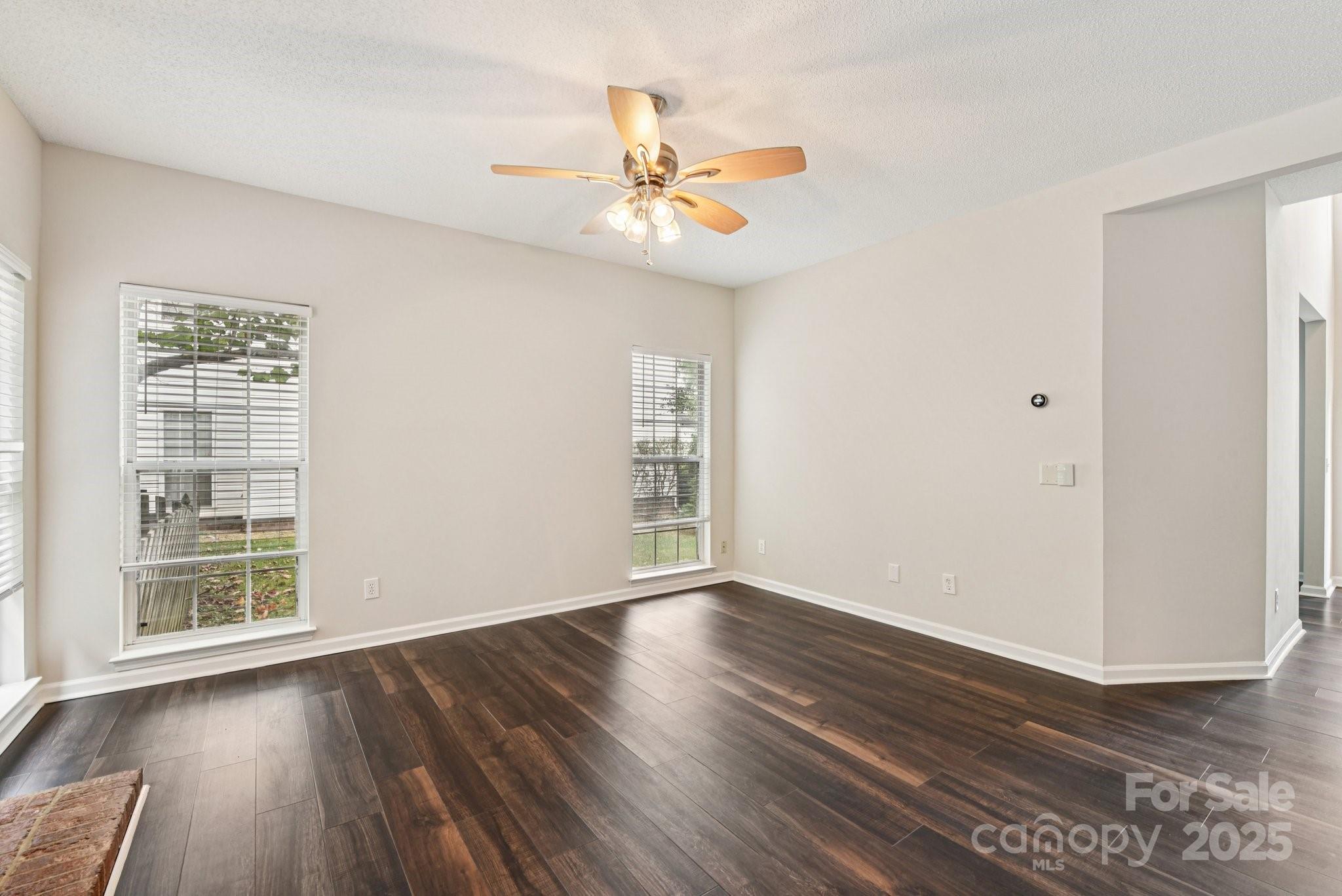 8700 Barrister Way Charlotte, NC 28216 - Photo 5 of 25 wooden floor in an empty room with a window