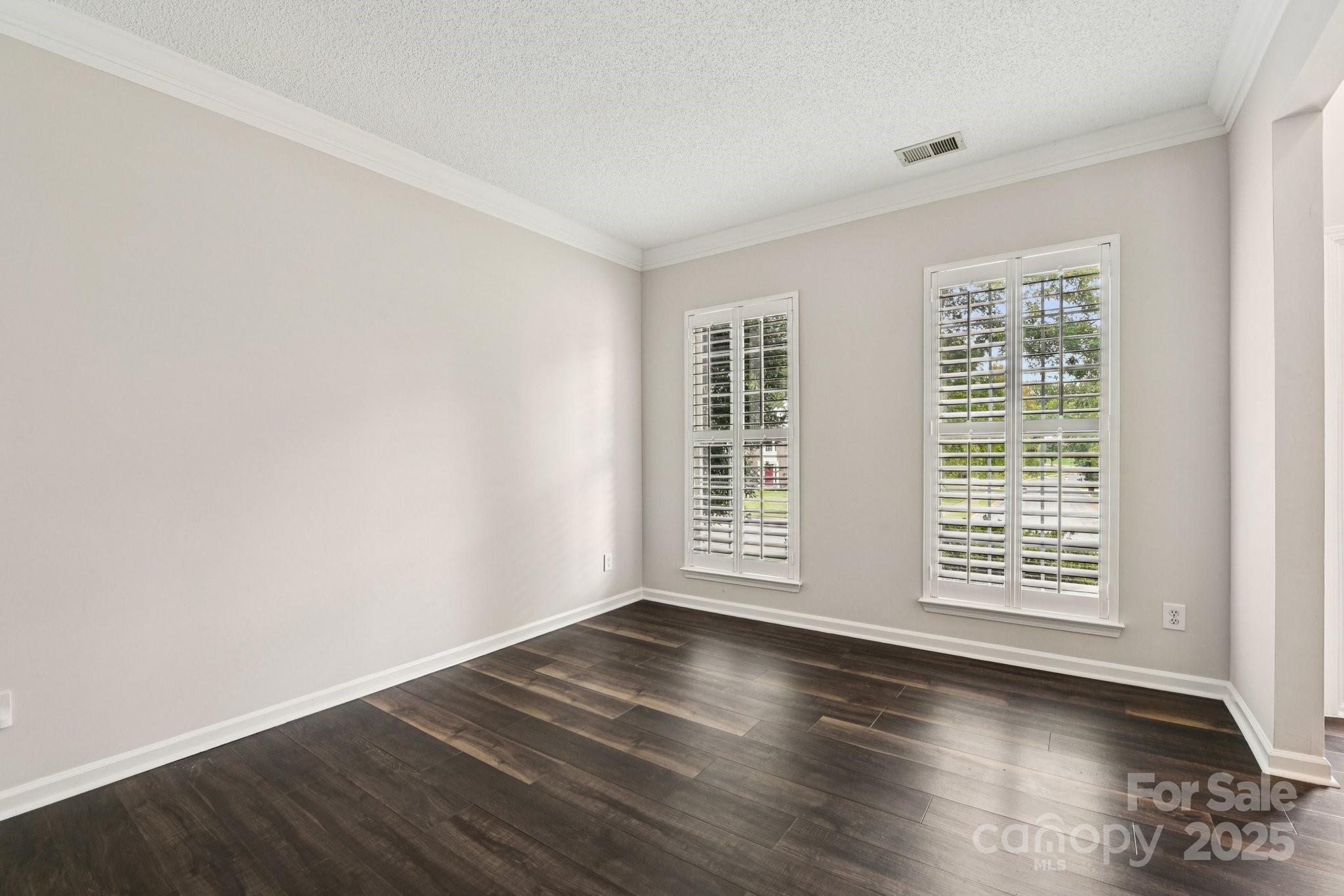 8700 Barrister Way Charlotte, NC 28216 - Photo 10 of 25 an empty room with wooden floor and windows
