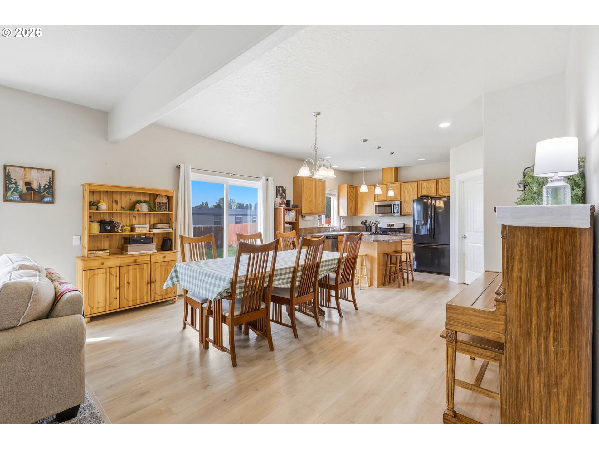 213 Sandy Court Boardman, OR 97818 - Photo 11 of 39 a living room with stainless steel appliances kitchen island granite countertop furniture and a dining table