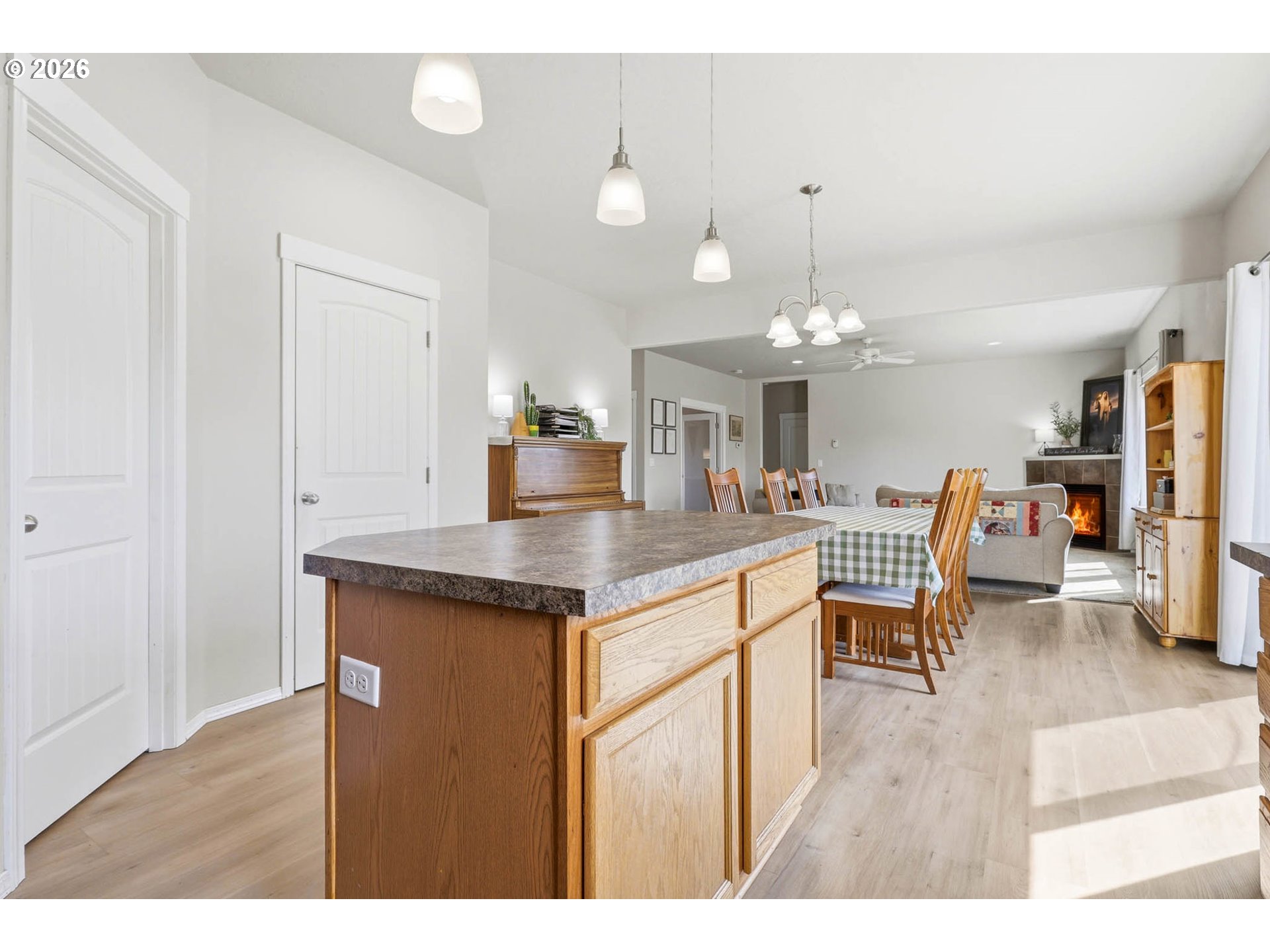 213 Sandy Court Boardman, OR 97818 - Photo 15 of 39 a open kitchen with stainless steel appliances granite countertop a stove top oven a sink dishwasher and white cabinets with wooden floor