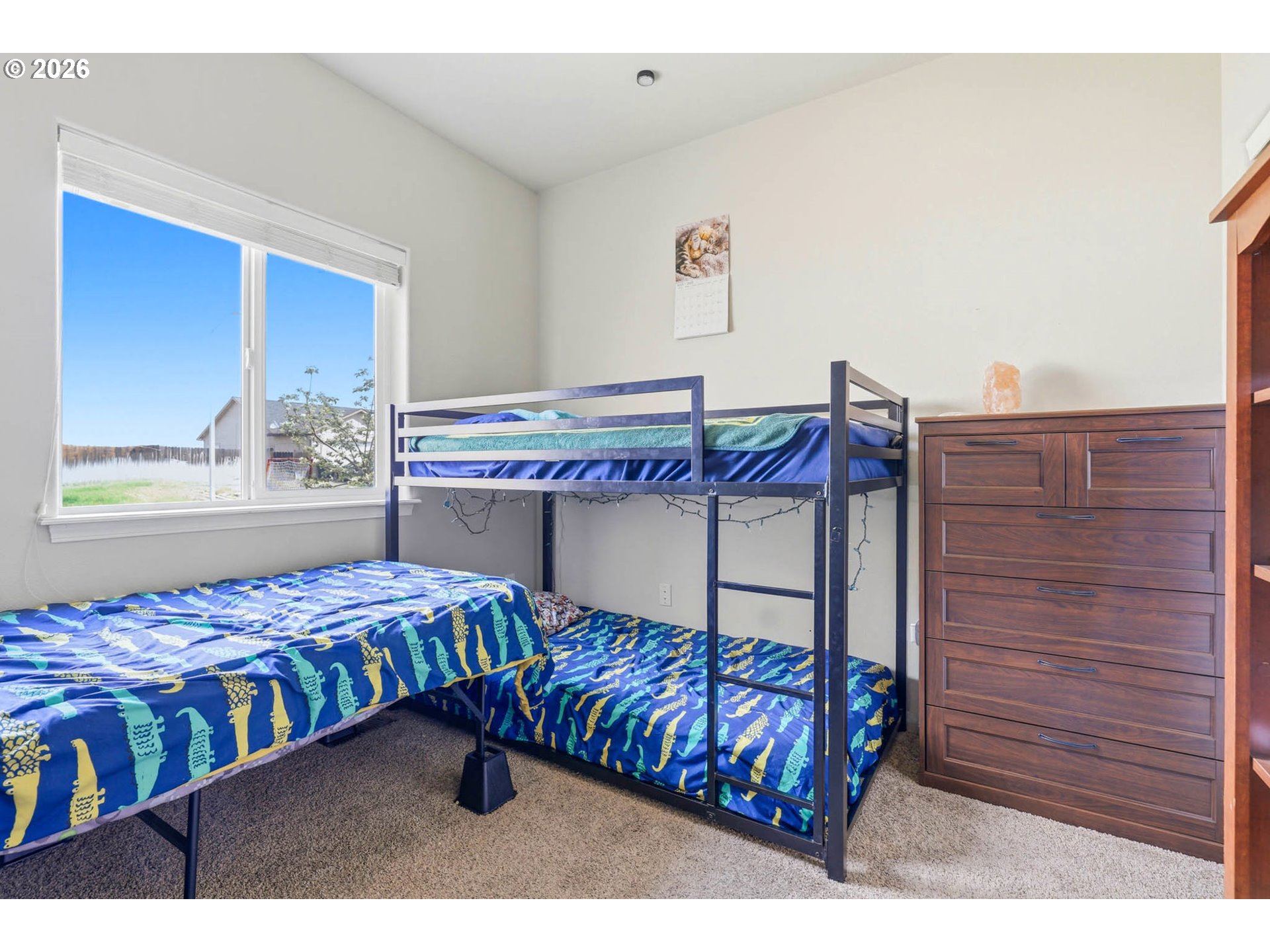 213 Sandy Court Boardman, OR 97818 - Photo 16 of 39 a bedroom with a bed and window