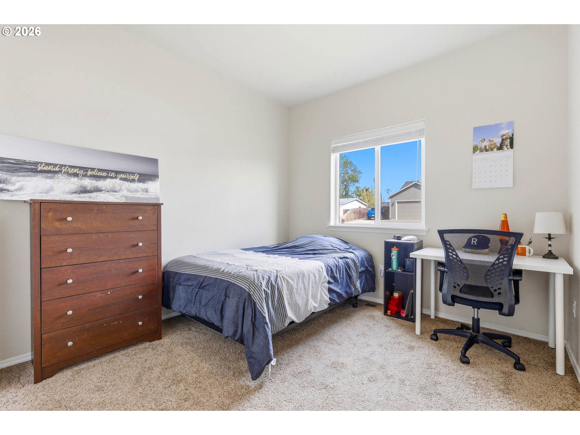 213 Sandy Court Boardman, OR 97818 - Photo 17 of 39 a bedroom with a bed and a desk