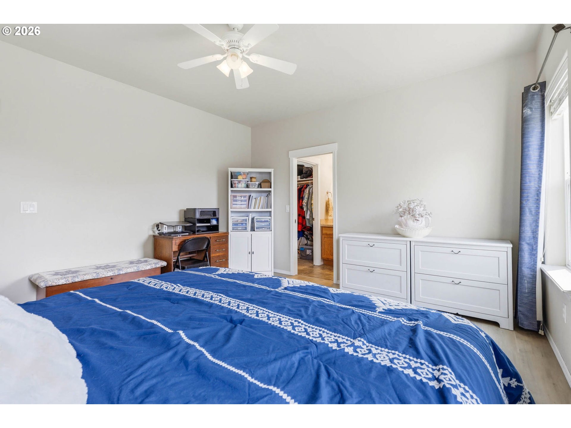 213 Sandy Court Boardman, OR 97818 - Photo 19 of 39 a bedroom with a bed and a dresser
