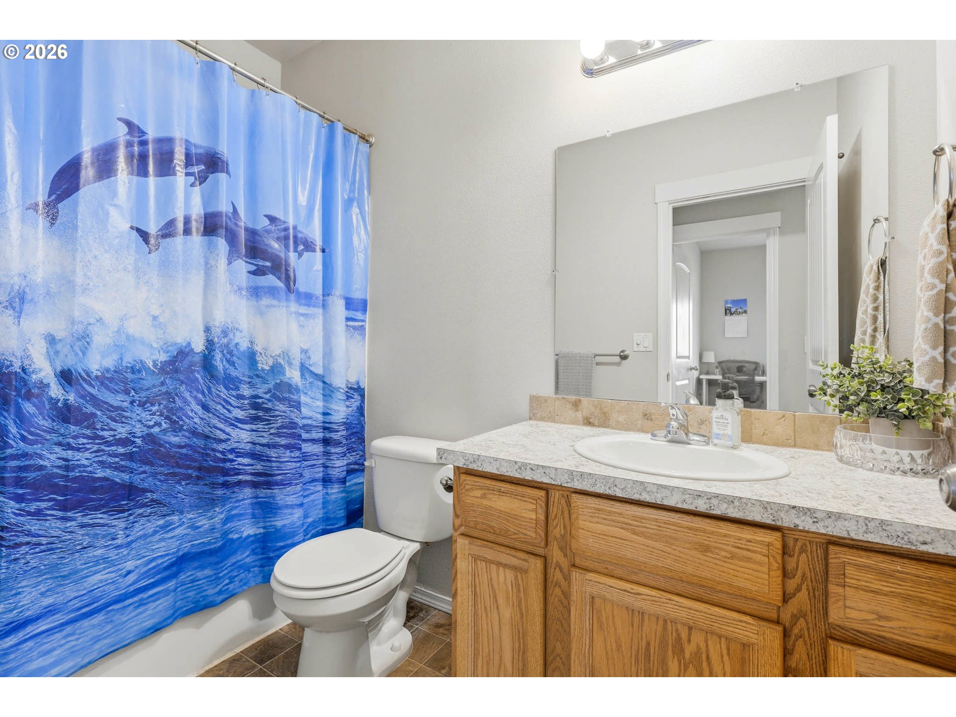 213 Sandy Court Boardman, OR 97818 - Photo 24 of 39 a bathroom with a granite countertop sink toilet mirror and shower