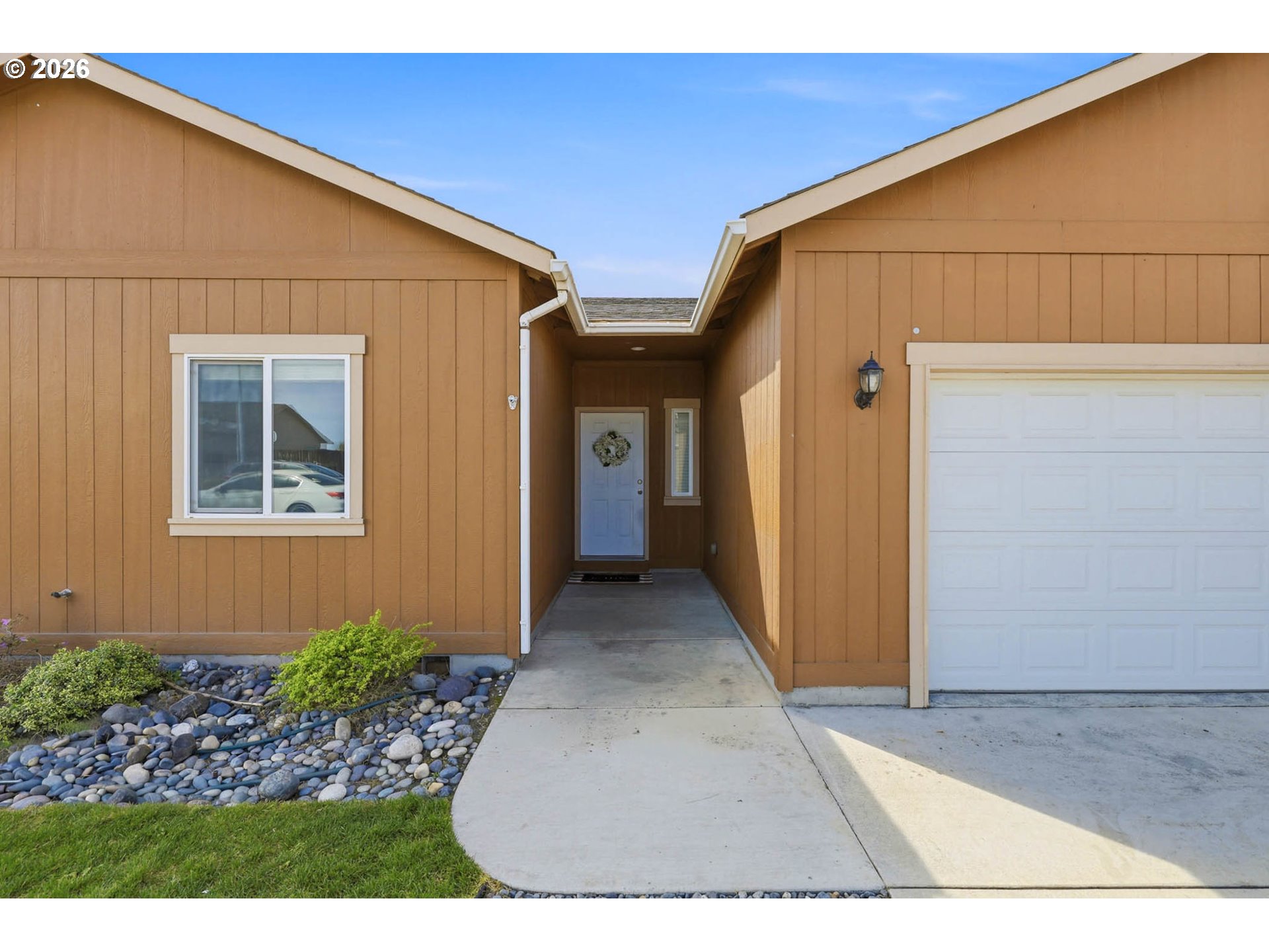 213 Sandy Court Boardman, OR 97818 - Photo 3 of 39 a view of backyard of house