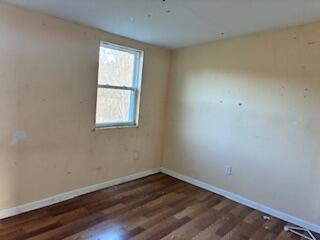 4100 Howard Street Hobart, IN 46342 - Photo 14 of 36 an empty room with wooden floor and windows