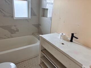 4100 Howard Street Hobart, IN 46342 - Photo 15 of 36 a bathroom with a tub and a toilet