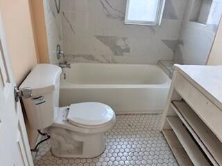 4100 Howard Street Hobart, IN 46342 - Photo 17 of 36 a bathroom with a sink and a toilet