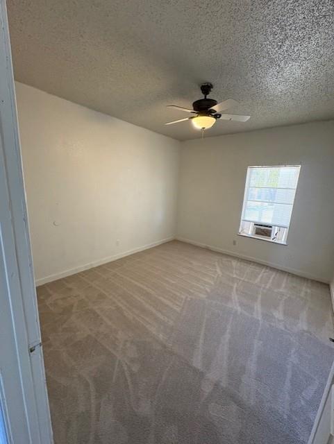 709 Grape Street, Unit B Abilene, TX 79601 - Photo 5 of 8 en empty room with ceiling fan and window