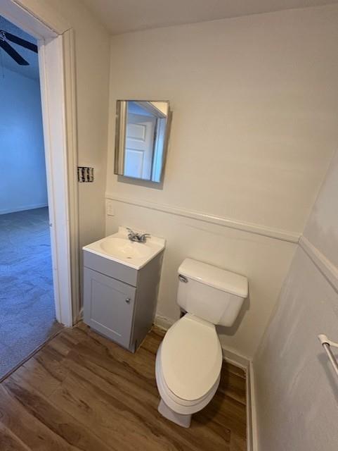 709 Grape Street, Unit B Abilene, TX 79601 - Photo 8 of 8 a bathroom with a toilet sink and mirror