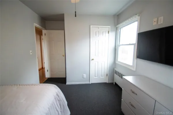 a view of empty room with window and fireplace