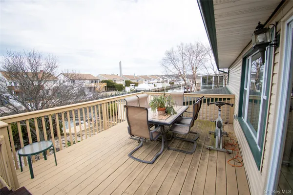 a view of balcony with furniture and wooden floor