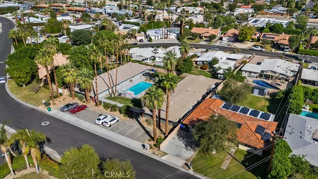 an aerial view of a house with swimming pool and outdoor space
