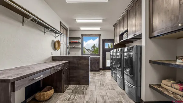 a kitchen with stainless steel appliances granite countertop a stove and a refrigerator