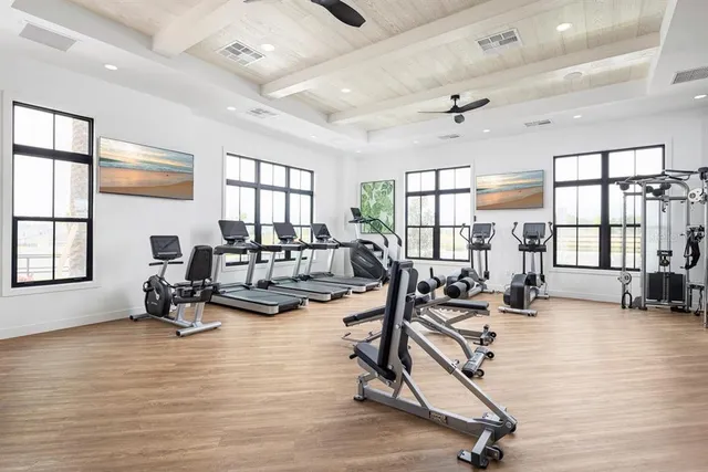 a living room with furniture pool table and a large window