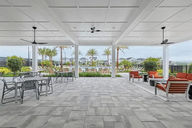 a view of a patio with a table and chairs
