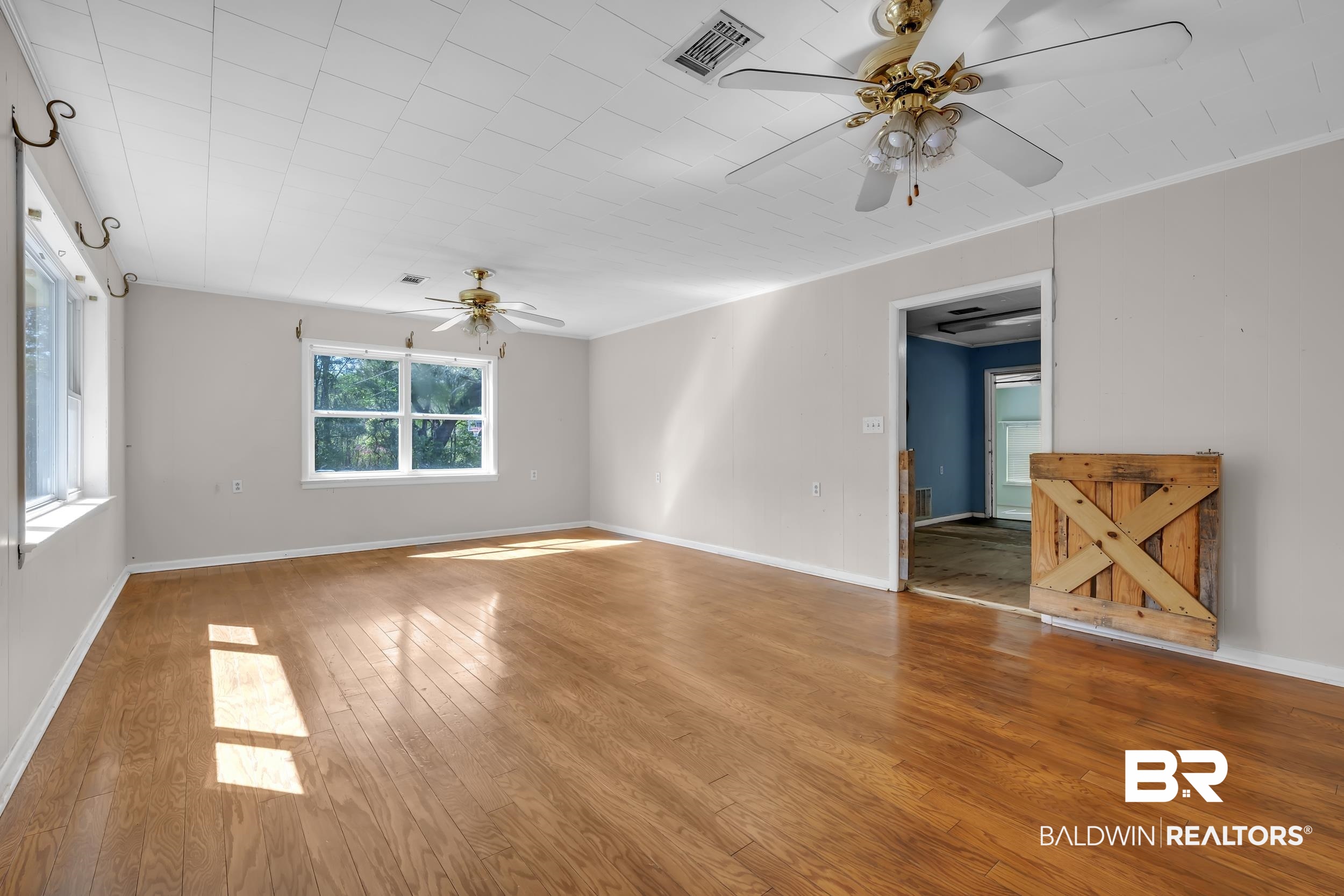 17463 Highway 98 Foley, AL 36535 - Photo 3 of 57 Spare room with a ceiling fan and wood-type flooring