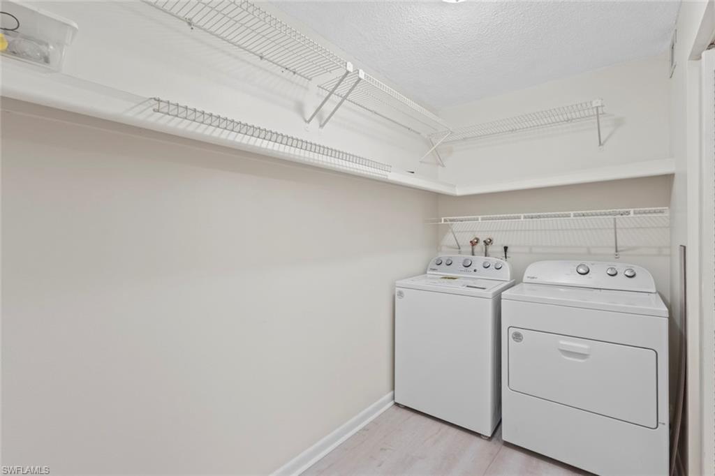 248 Palm Drive, Unit 5 Naples, FL 34112 - Photo 18 of 37 a utility room with dryer and washer