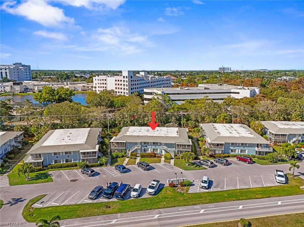 248 Palm Drive, Unit 5 Naples, FL 34112 - Photo 21 of 37 an aerial view of residential houses with outdoor space