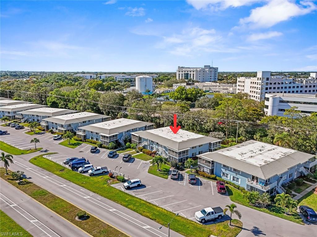 248 Palm Drive, Unit 5 Naples, FL 34112 - Photo 22 of 37 a view of a patio with furniture and a table