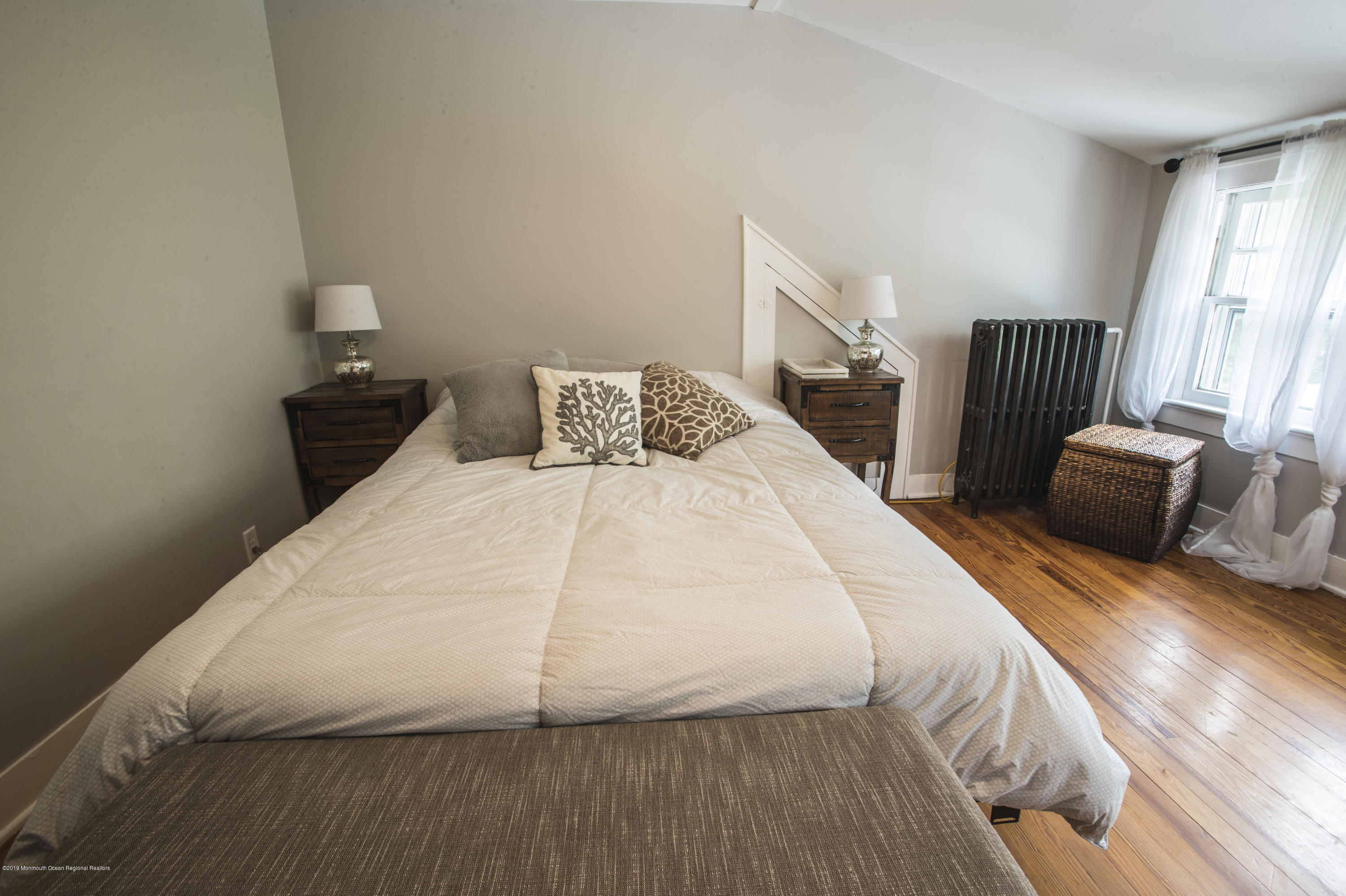 204 Leesville Road Jackson, NJ 08527 - Photo 19 of 49 a bedroom with a bed and wooden floor