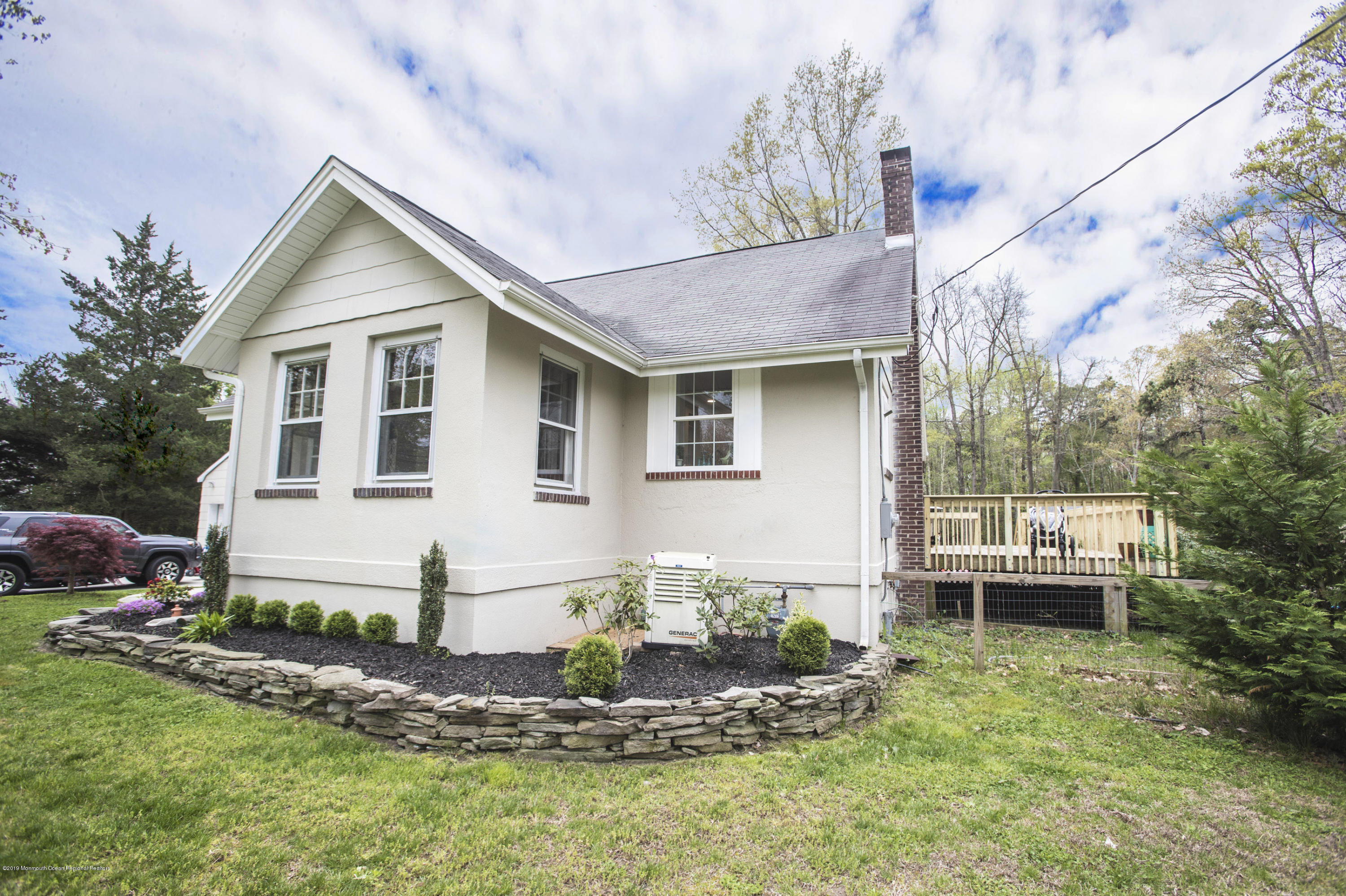 204 Leesville Road Jackson, NJ 08527 - Photo 36 of 49 a front view of a house with a garden and plants