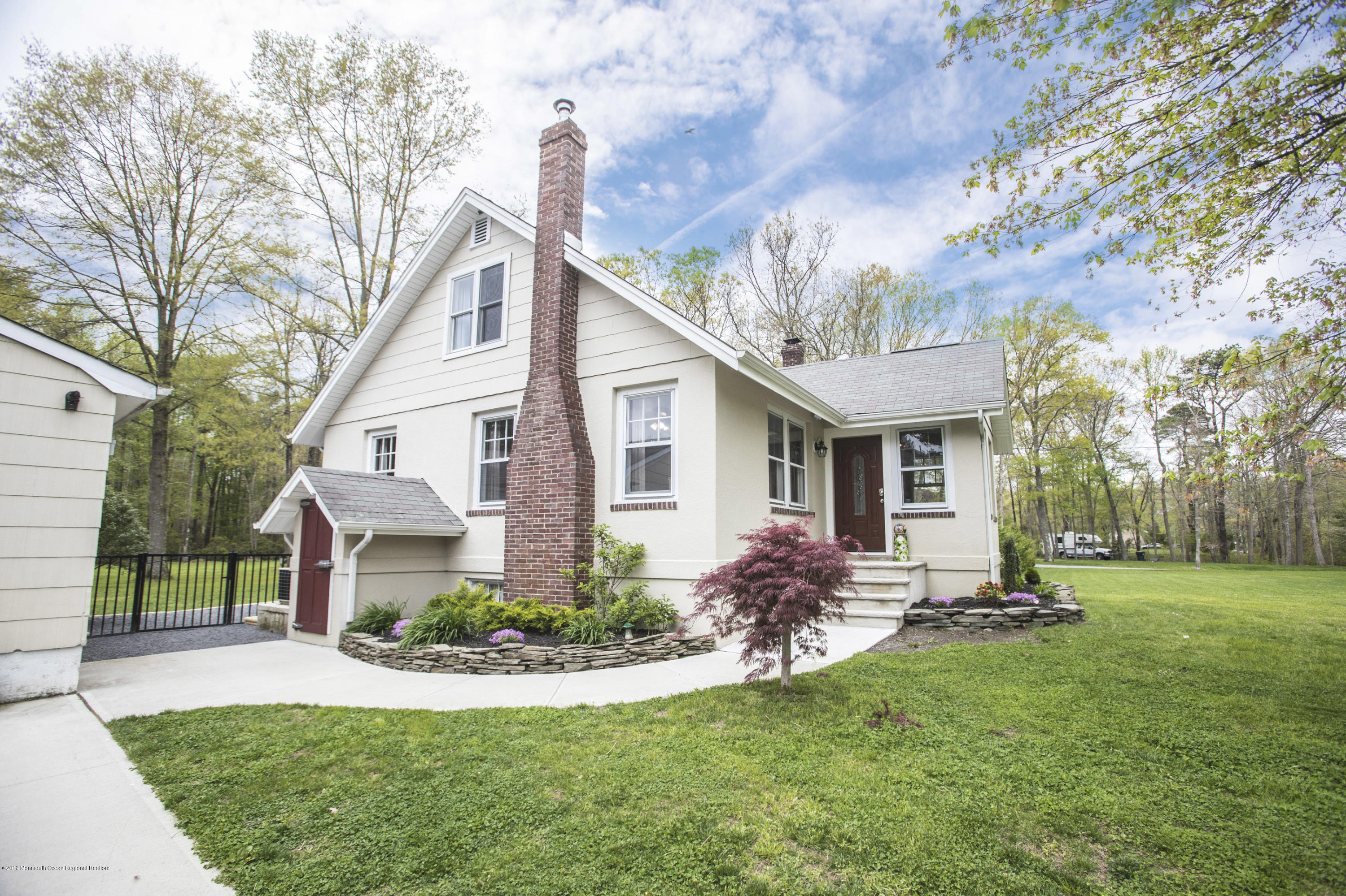 204 Leesville Road Jackson, NJ 08527 - Photo 37 of 49 a front view of a house with a yard and trees