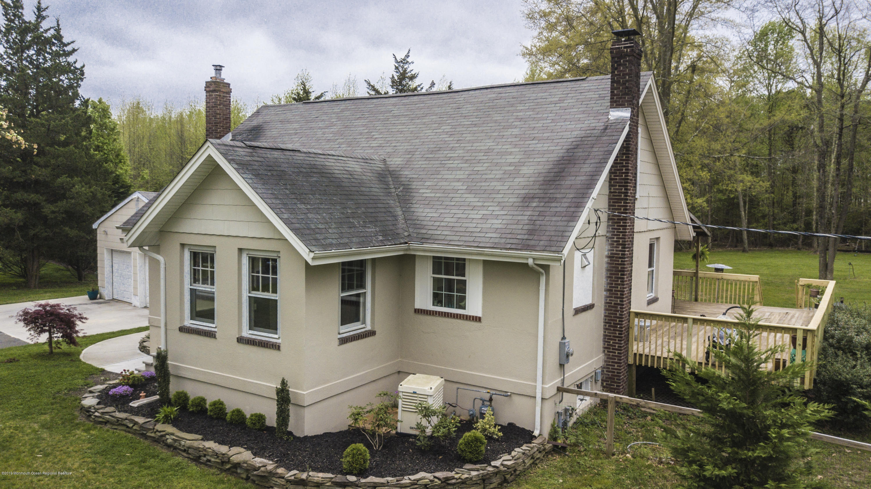 204 Leesville Road Jackson, NJ 08527 - Photo 40 of 49 a white house with a small yard and large trees