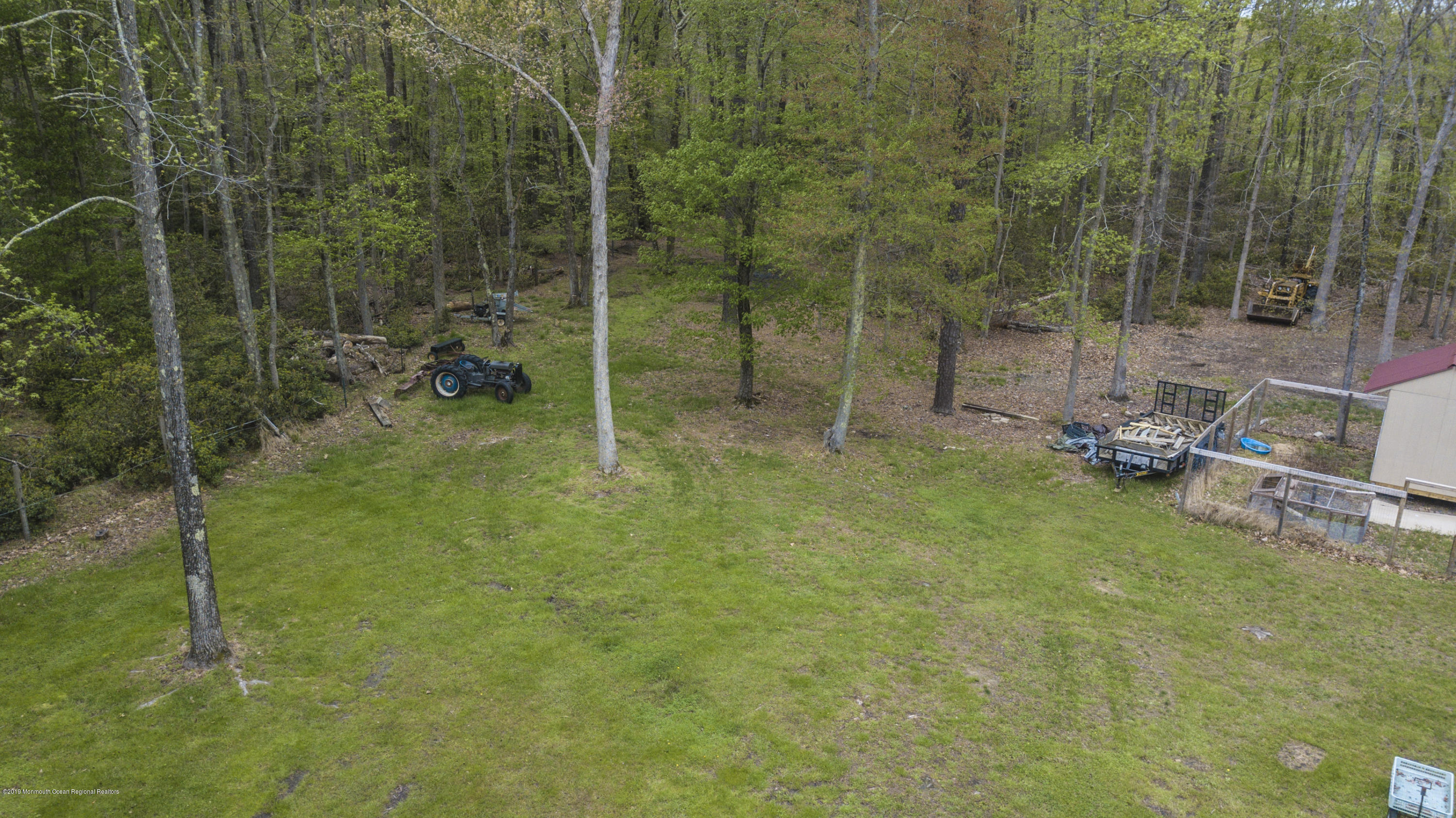 204 Leesville Road Jackson, NJ 08527 - Photo 46 of 49 a view of a forest with a bench and trees
