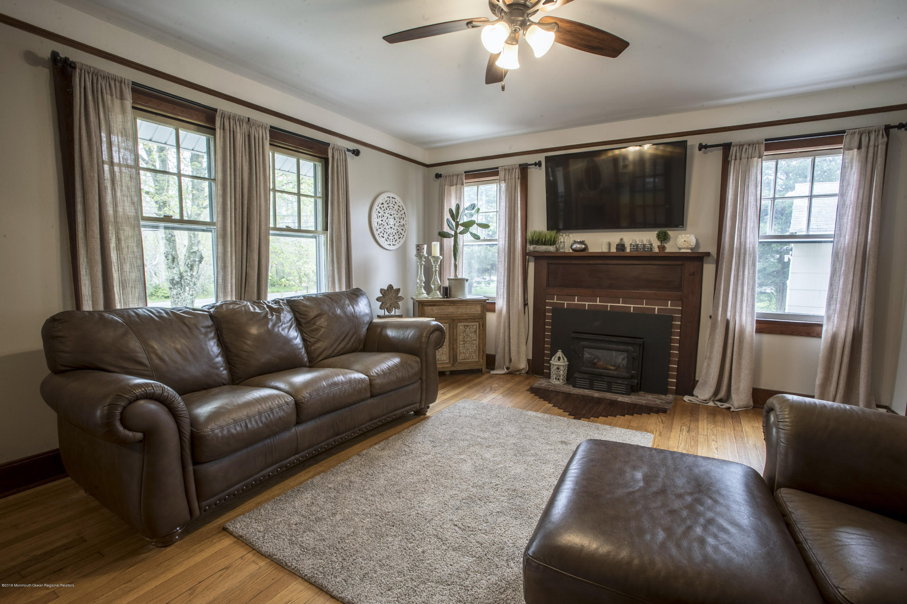 204 Leesville Road Jackson, NJ 08527 - Photo 6 of 49 a living room with furniture and a fireplace