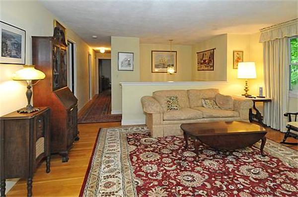 15 Holly Road Reading, MA 01867 - Photo 15 of 16 a living room with a couch and a table