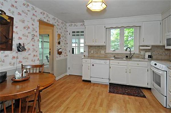 15 Holly Road Reading, MA 01867 - Photo 3 of 16 a kitchen with a sink window and cabinets